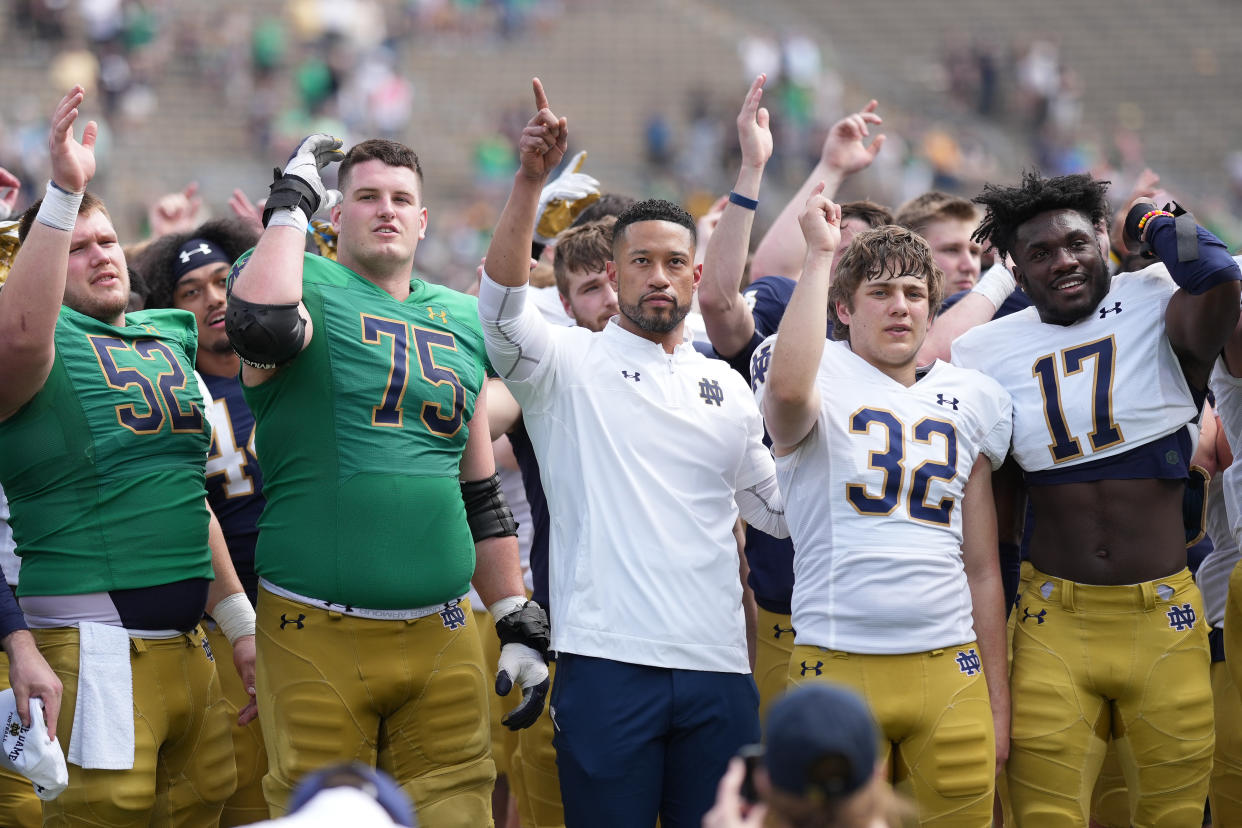 SOUTH BEND, IN - APRIL 23: Notre Dame Fighting Irish head coach Marcus Freeman celebrates with players after the Notre Dame Blue-Gold Spring Football Game on April 23, 2022 at Notre Dame Stadium in South Bend, IN. (Photo by Robin Alam/Icon Sportswire via Getty Images)