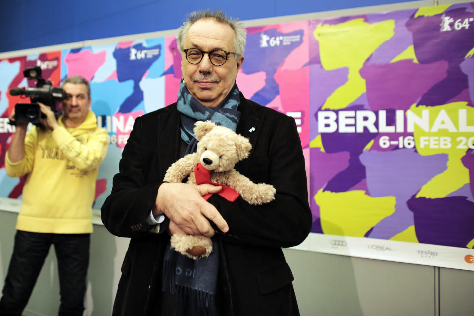 Dieter Kosslick director of the International Film Festival Berlin, Berlinale, poses with a Berlinale bear for media prior to the annual program press conference in Berlin, Tuesday, Jan. 28, 2014. The 64. Berlinale will take place in the German capital from Thursday, Feb. 6, until Sunday, Feb. 16, 2014. (AP Photo/Markus Schreiber)