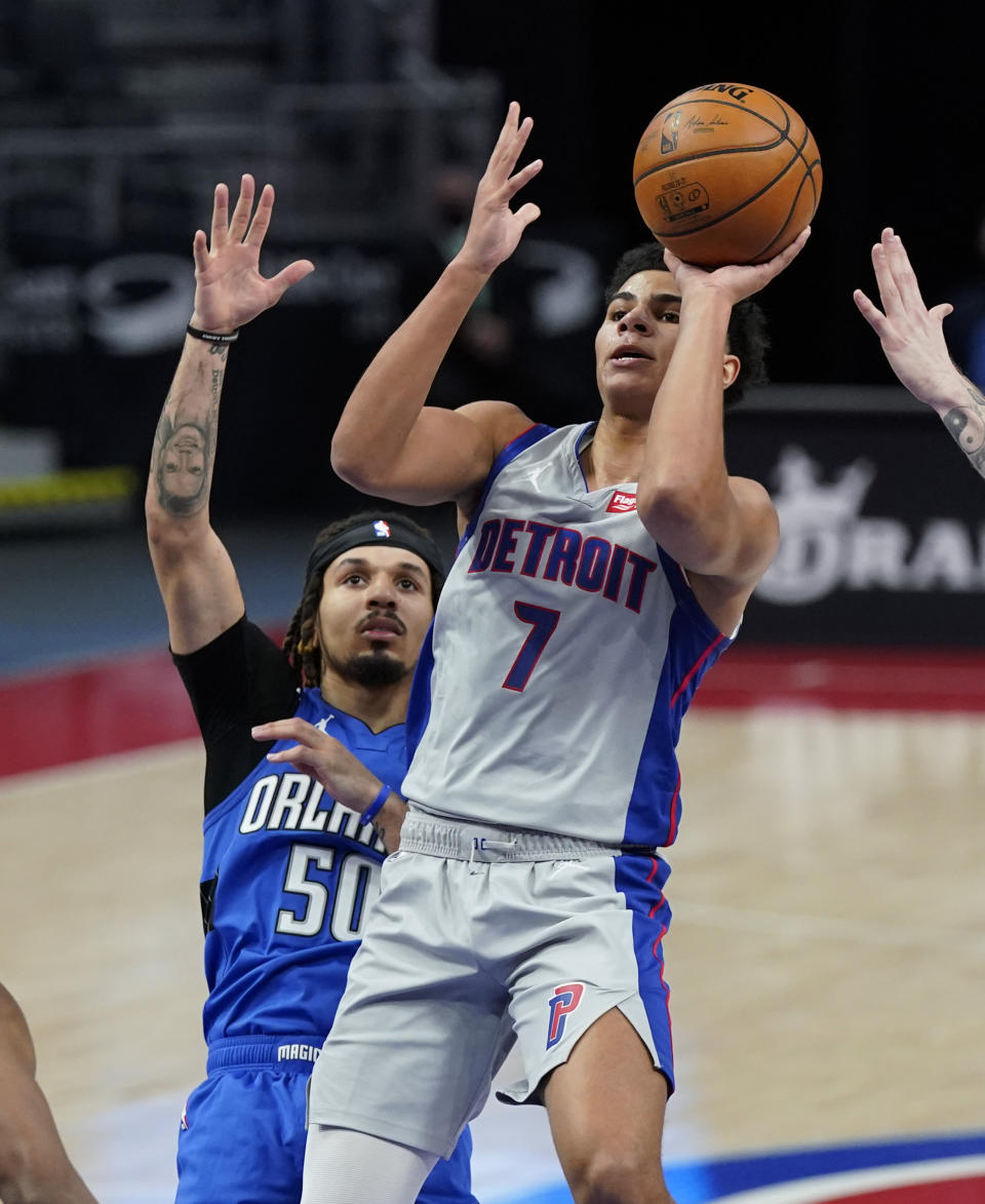 Detroit Pistons guard Killian Hayes (7) is defended by Orlando Magic guard Cole Anthony (50) during the first half of an NBA basketball game, Monday, May 3, 2021, in Detroit. (AP Photo/Carlos Osorio)
