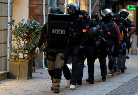 Members of French special police forces of Research and Intervention Brigade (BRI) leave following a police operation the day after a shooting in Strasbourg, France, December 12, 2018. REUTERS/Vincent Kessler