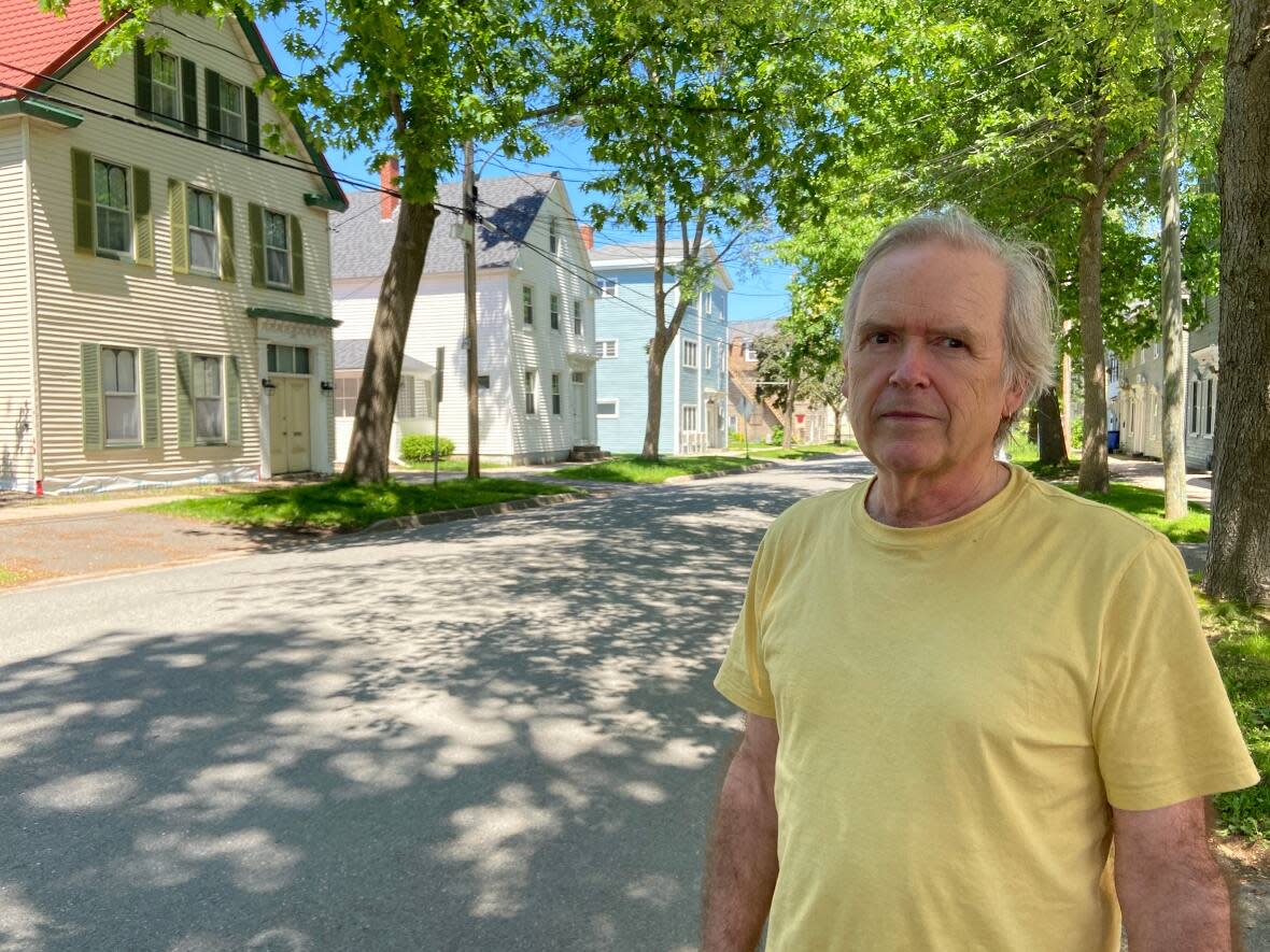 Jeremy Mouat, president of the Fredericton Heritage Trust, says he's concerned that housing growth in Frederiction will come at the expense of historically significant building. (Aidan Cox/CBC - image credit)