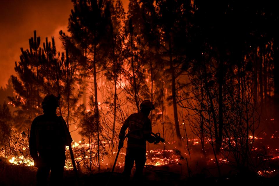 Firefighters are at work to extinguish a wildfire in Cardigos village in Macao, central Portugal on July 21, 2019. (Photo: Patricia De Melo Moreira/AFP/Getty Images)