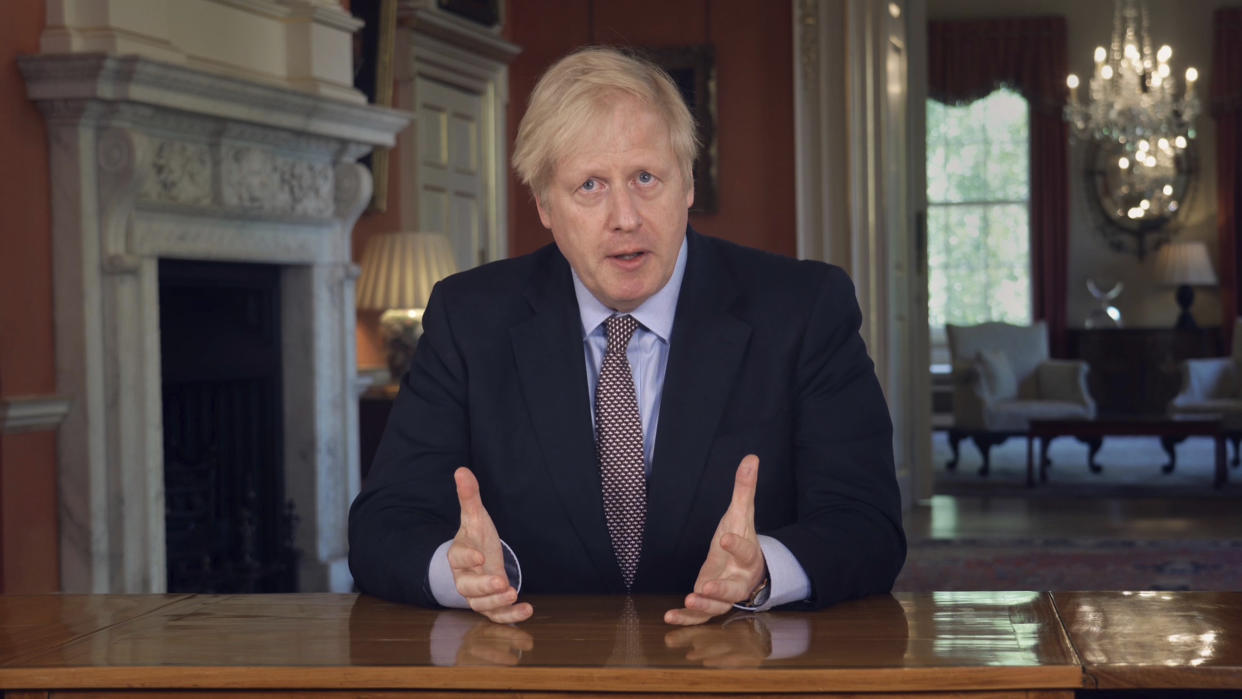 In this grab taken from video issued by Downing Street on Sunday, May 10, 2020, Britain's Prime Minister Boris Johnson delivers an address on lifting the country's lockdown amid the coronavirus pandemic. (Downing Street via AP)