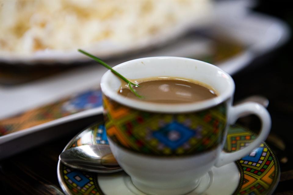 A cup of coffee placed on a table during an Ethiopian Coffee Ceremony at Abol Cafe on Friday afternoon, June 30, 2023.