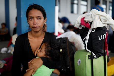 The Wider Image: Venezuelan mothers, children in tow, rush to migrate