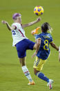 United States forward Megan Rapinoe, left tries to control the ball as she gets in front of Colombia midfielder Jessica Caro (8) during the first half of an international friendly soccer match, Monday, Jan. 18, 2021, in Orlando, Fla. (AP Photo/John Raoux)