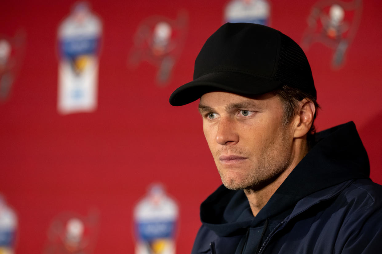 MUNICH, GERMANY - NOVEMBER 13: Tom Brady #12 of the Tampa Bay Buccaneers speaks to the media after their side's victory in the NFL match between Seattle Seahawks and Tampa Bay Buccaneers at Allianz Arena on November 13, 2022 in Munich, Germany. (Photo by Sebastian Widmann/Getty Images)