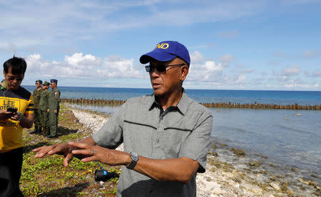 Filipino Defence Secretary Delfin Lorenzana talks to reporters in Philippine occupied Thitu Island in the Spratly Islands at disputed South China Sea, April 21, 2017. REUTERS/Erik De Castro