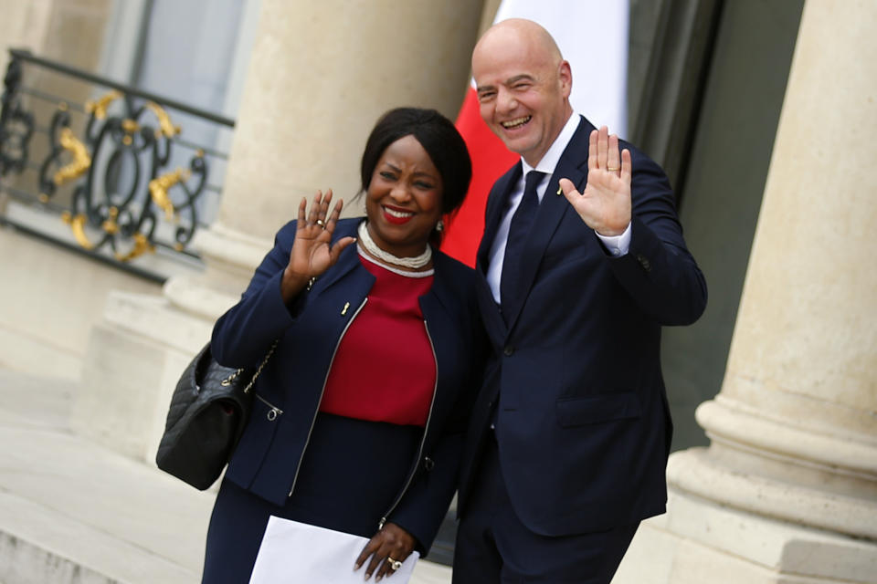 FIFA President Gianni Infantino, right, and FIFA Secretary General Fatma Samba Diouf Samoura arrive for a meeting at the Elysee Palace in Paris, Tuesday, June 4, 2019. (AP Photo/Francois Mori)