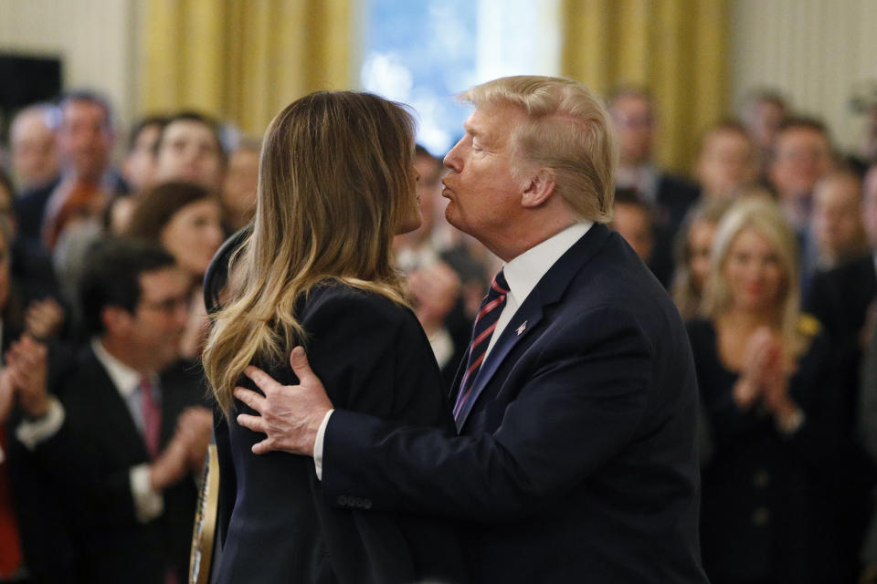 President Donald Trump kisses First Lady Melania Trump in the East Room of the White House in Washington, Thursday, Feb. 6, 2020. (AP Photo/Patrick Semansky)