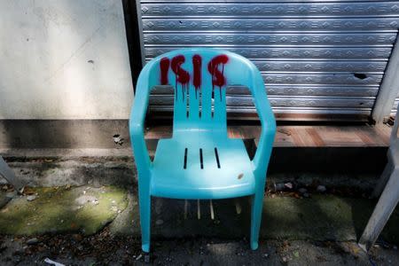 A chair is seen in Marawi as government troops continue their assault against insurgents from the Maute group in Marawi, Philippines July 1, 2017. REUTERS/Jorge Silva