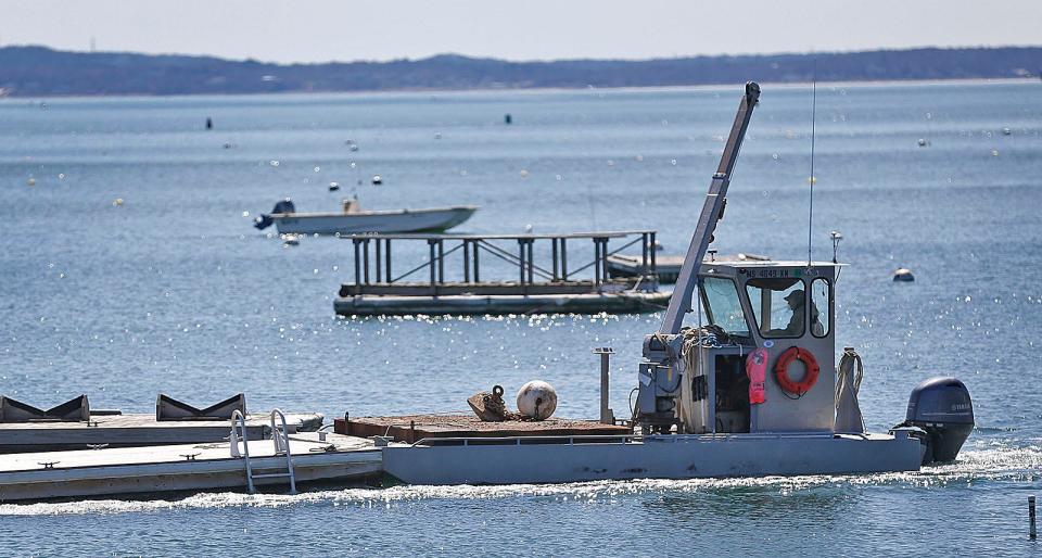 As the weather warms, Duxbury Bay comes alive with oyster farmers planting seed shellfish on Monday, April 11, 2022.