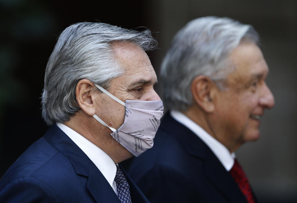 Argentina's President Alberto Fernandez attends a ceremony with Mexican President Andres Manuel Lopez Obrador at the National Palace in Mexico City, Tuesday, Feb. 23, 2021, amid the COVID-19 pandemic. Fernandez is on a four-day official visit to Mexico. (AP Photo/Marco Ugarte)