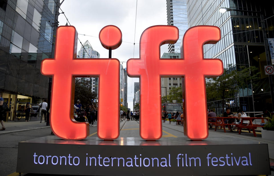 FILE - In this Thursday, Sept. 6, 2018, file photo, a view of a festival sign appears on Day 1 of the Toronto International Film Festival in Toronto. TIFF organizers announced Tuesday, July 23, 2019, that the upcoming festival will include the premieres of the superhero film “Joker,” a Mister Rogers biopic starring Tom Hanks and “Hustlers,” a film about strippers scamming Wall Street bankers, with Jennifer Lopez and Cardi B. (Photo by Chris Pizzello/Invision/AP, File)