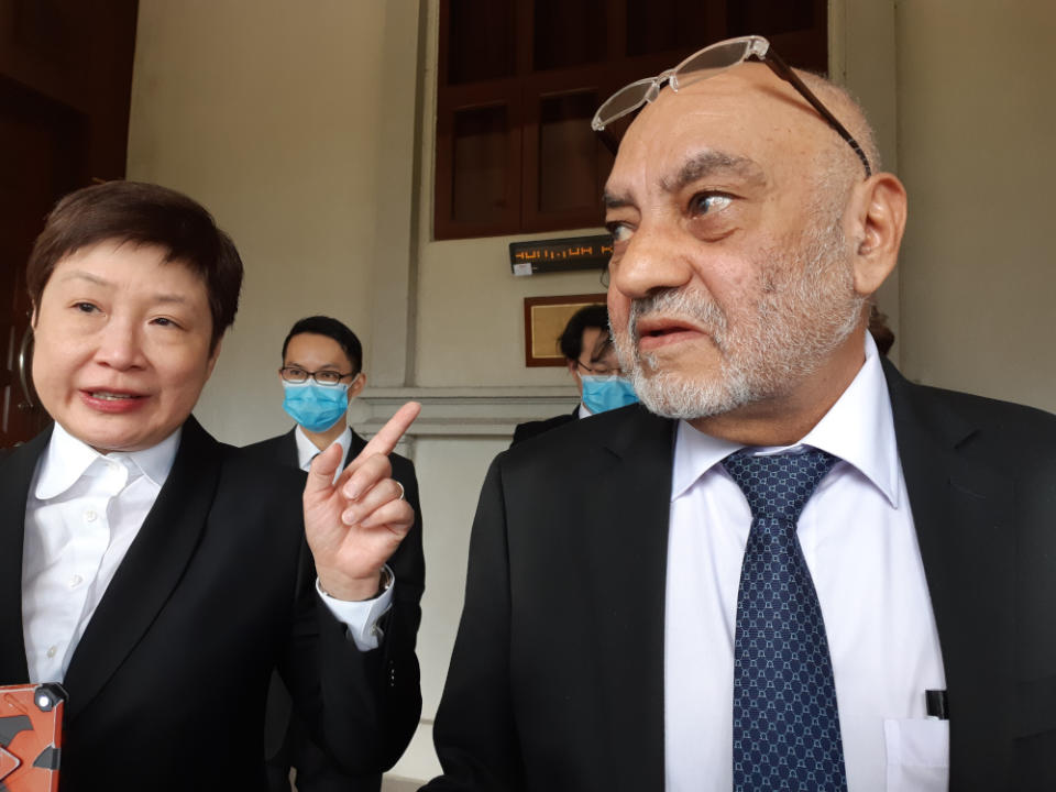 Ambank Islamic Bank Berhad’s and AMMB Holdings Berhad’s lawyer Yoong Sin Min and Joanna Yu’s lawyer Datuk Gurdial Singh Nijar speak to reporters at the Kuala Lumpur Court Complex, September 28, 2020. — Picture by Ida Lim