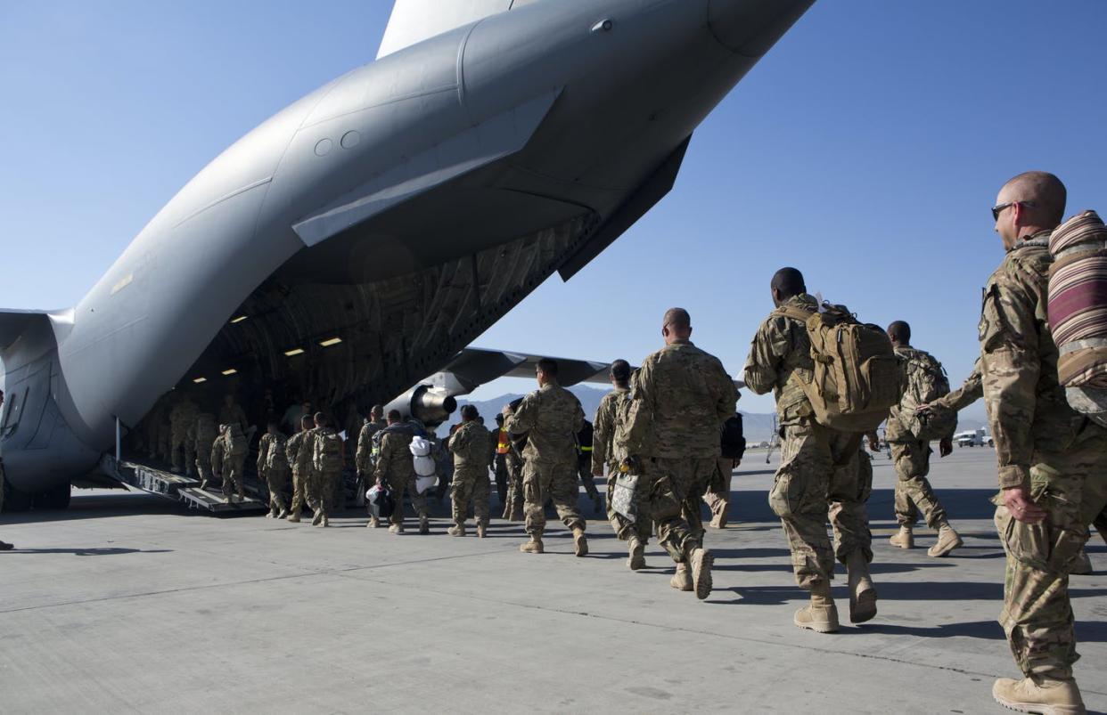 <span class="caption">U.S. Army soldiers walk to their C-17 cargo plane for departure on May 11, 2013, at Bagram Air Base in Afghanistan.</span> <span class="attribution"><a class="link " href="https://www.gettyimages.com/detail/news-photo/army-soldiers-walk-to-their-c-17-cargo-plane-for-departure-news-photo/483252999?adppopup=true" rel="nofollow noopener" target="_blank" data-ylk="slk:Robert Nickelsberg/Getty Images;elm:context_link;itc:0;sec:content-canvas">Robert Nickelsberg/Getty Images</a></span>