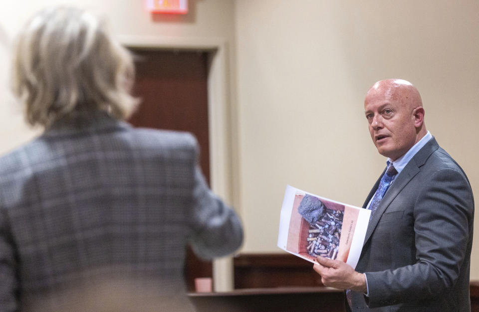 Special prosecutor Kari Morrissey, left, and defense attorney Jason Bowles discuss showing a picture to a witness during the trial for Hannah Gutierrez-Reed, the former armorer on the set of "Rust," at district court in Santa Fe, N.M. on Wednesday, Feb. 28, 2024. (Luis Sánchez Saturno/Santa Fe New Mexican via AP, Pool)