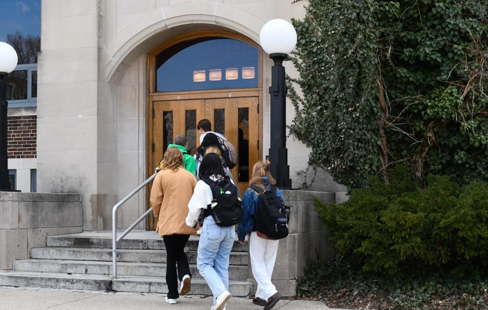 A group of Michigan State University students enter the MSU Union Monday, April 3, 2023. The iconic student union building has been closed since the Feb. 13 shooting on campus, reopening Monday morning.