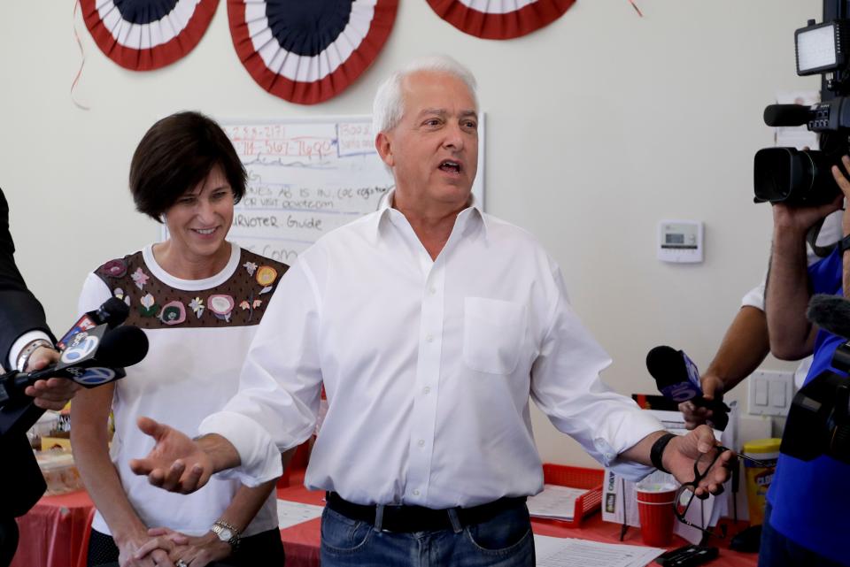 California Republican gubernatorial candidate John Cox speaks during campaign stop as Rep. Mimi Walters, R-Calif., looks on, Tuesday, Nov. 6, 2018, in Irvine, Calif. (AP Photo/Chris Carlson)