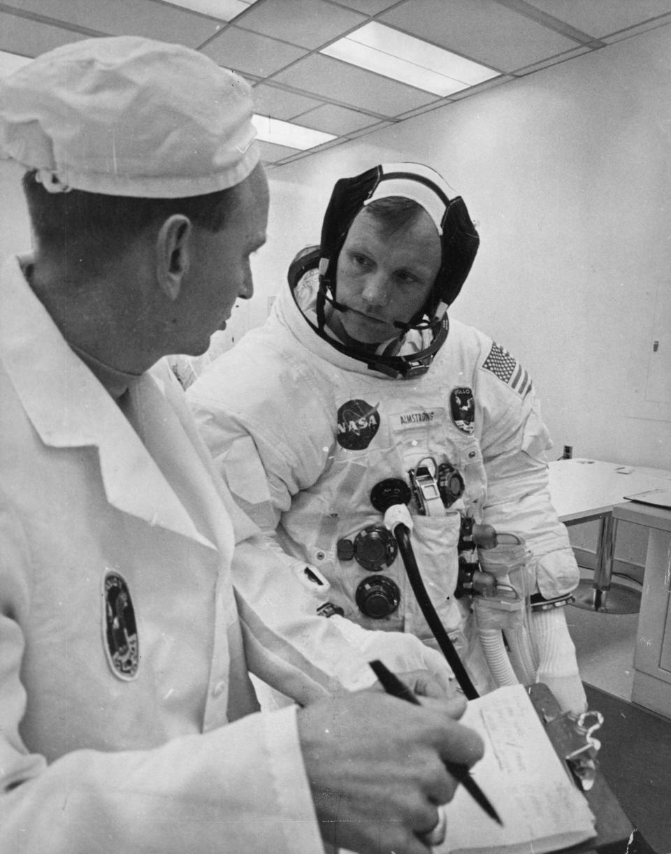 Apollo 11 commander Neil Armstrong runs through final notes before the launch of the Apollo/Saturn V space vehicle at the Kennedy Space Centre, Florida on July 16, 1969.  (Photo by NASA/Keystone/Getty Images)