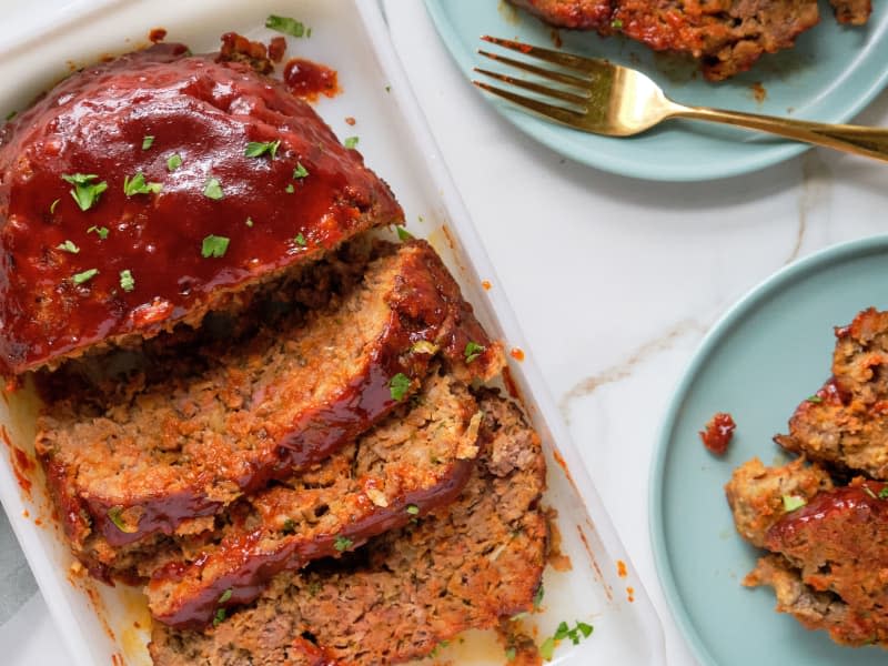 Gochujang Meatloaf in a white dish and on two blue dishes