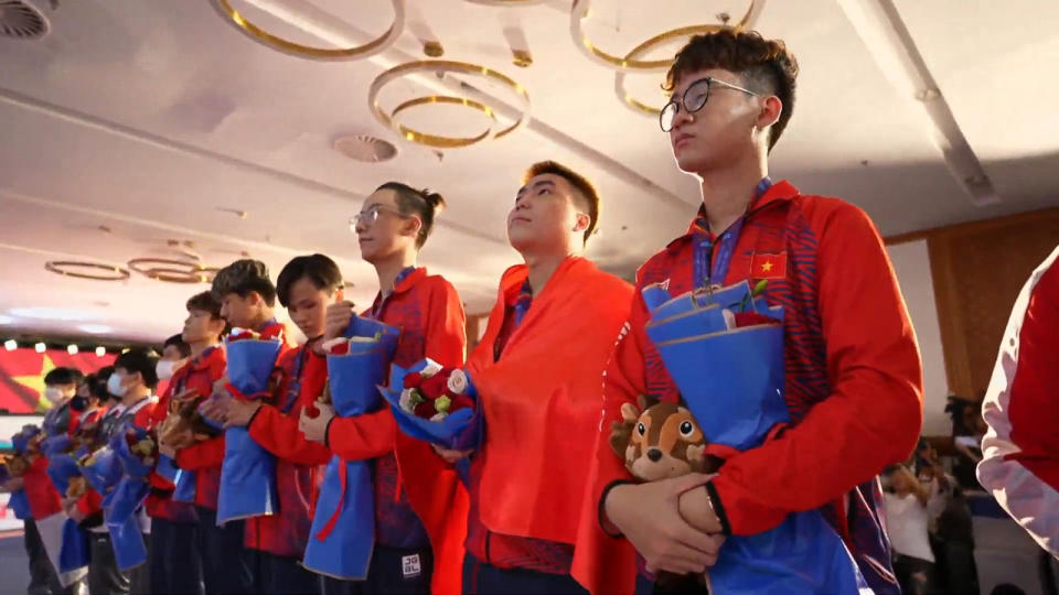 Vietnam's Men's League of Legends: Wild Rift team stand for their national anthem after winning the gold medal. (Screenshot courtesy of official 31st SEA Games Youtube channel)