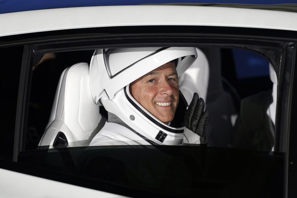 NASA astronaut Shane Kimbrough waves as he leaves the operations and checkout building before a launch attempt Friday, April 23, 2021, at the Kennedy Space Center in Cape Canaveral, Fla. Four astronauts will fly on the SpaceX Crew mission to the International Space Station scheduled for launch on April 23, 2021. (AP Photo/John Raoux)