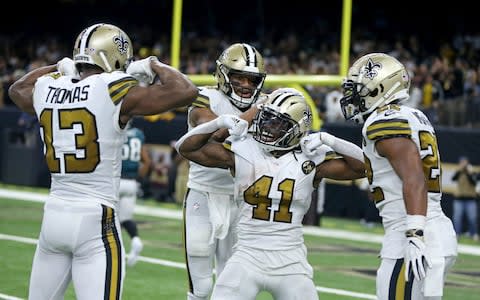 New Orleans Saints running back Alvin Kamara (41) celebrates his fourth quarter touchdown catch with teammates including wide receiver Michael Thomas (13) and running back Mark Ingram (22) against the Philadelphia Eagles at the Mercedes-Benz Superdome - Credit: Chuck Cook/USA TODAY