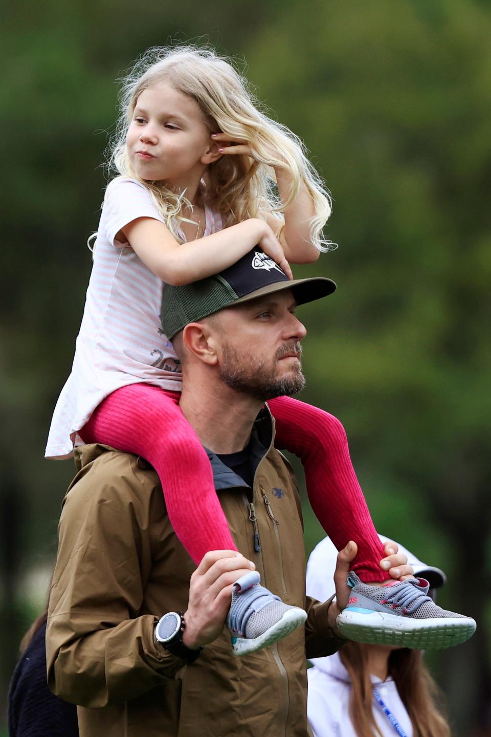 A father and his daughter watch Players Championship action at the fourth hole during the first round of last year's tournament.