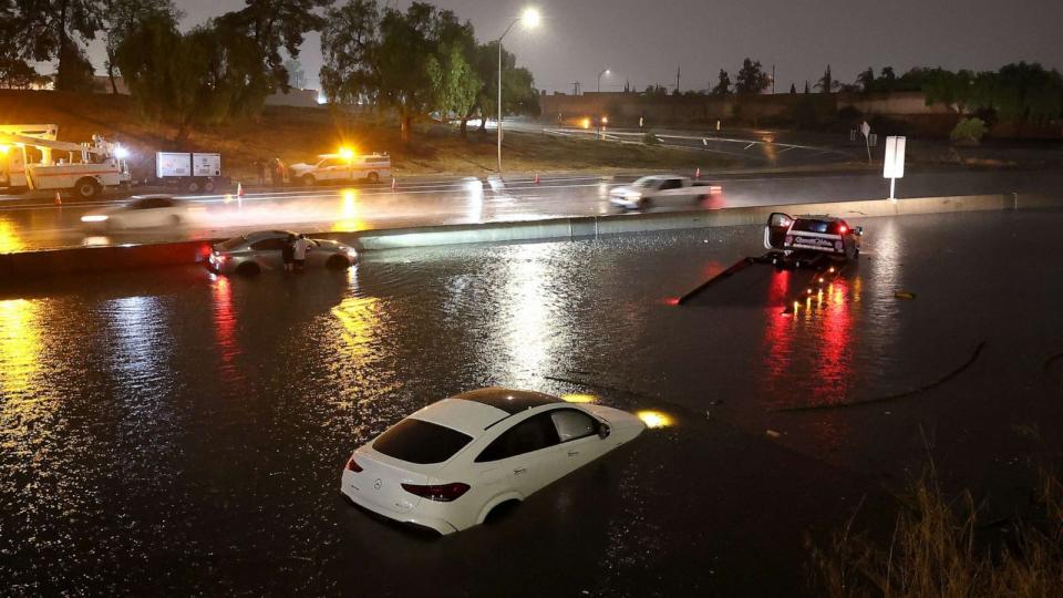 PHOTO: Cars are seen submerged in floodwaters on the Golden State Freeway as tropical storm Hilary moves through the area on Aug. 20, 2023, in Sun Valley, Calif. (Justin Sullivan/Getty Images)