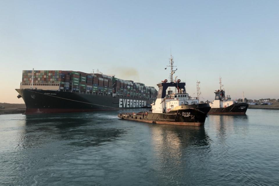 Tugboats drag the freed Ever Given out of the way (SUEZ CANAL AUTHORITY/AFP/Getty)