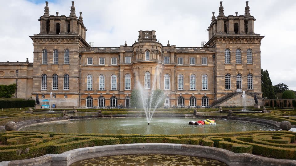 "Daddy, Daddy", a large scale recreation of the drowning Disney character Pinocchio, created by artist Maurizio Cattelan, is seen in a pool at Blenheim Palace on September 12, 2019. The golden toilet, titled "America," was part of the same exhibition at the stately home. - Leon Neal/Getty Images