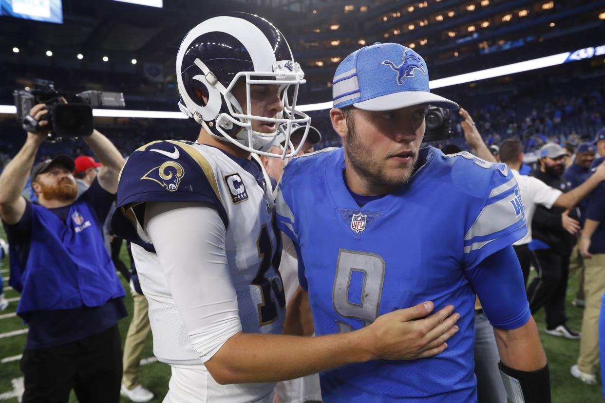 Los Angeles Rams quarterback Jared Goff, front left, meets with Detroit Lions quarterback Matthew Stafford after an NFL football game, Sunday, Dec. 2, 2018, in Detroit. (AP Photo/Paul Sancya)