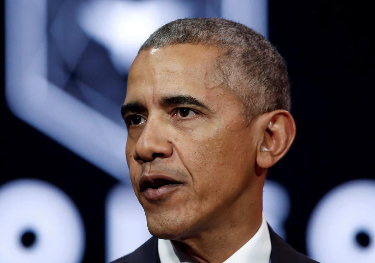 Former President Barack Obama, who ran against Sen. John McCain in the 2008 presidential election, paid tribute to the senator after he died Saturday.&nbsp; (Photo: Reuters/Benoir Tessier)