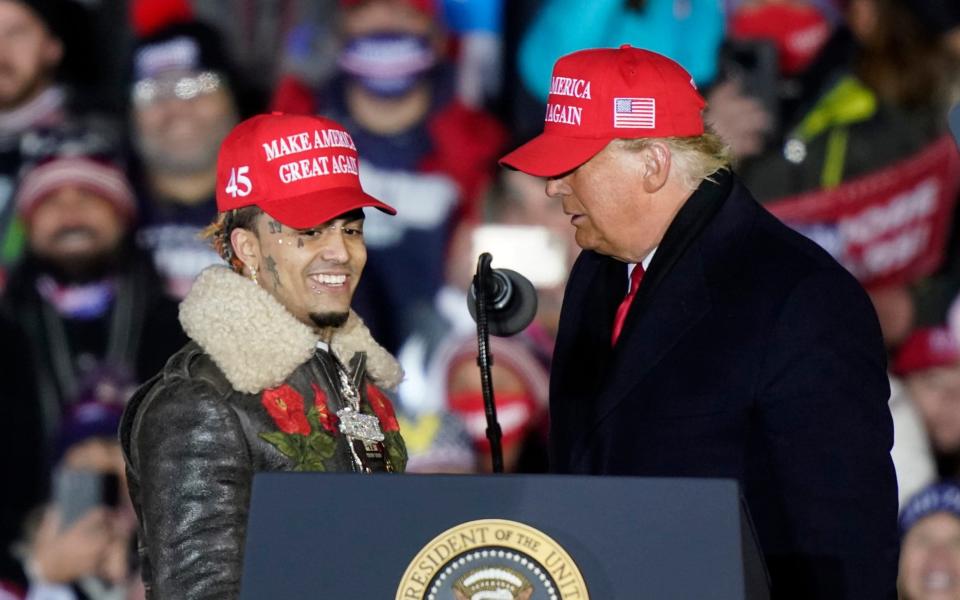 Lil Pump joins Trump on stage at the president's final campaign event late yesterday - AP