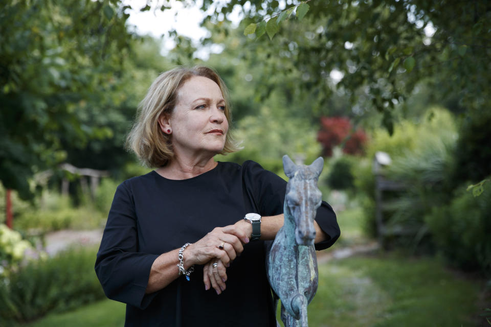 FILE - In this July 12, 2019, file photo, former opera singer Patricia Wulf, poses for a portrait in her home in Virginia. Wulf and Angela Turner Wilson, who have accused Placido Domingo of sexual misconduct reacted angrily to his claims in recent interviews that he never behaved improperly and always acted gallantly and like a gentleman with women. They issued a statement Tuesday, Dec. 3, 2019, saying they found Domingo's comments and his "continued failure to take responsibility for wrongdoing" to be disappointing and deeply disturbing. (AP Photo/Jacquelyn Martin, File)