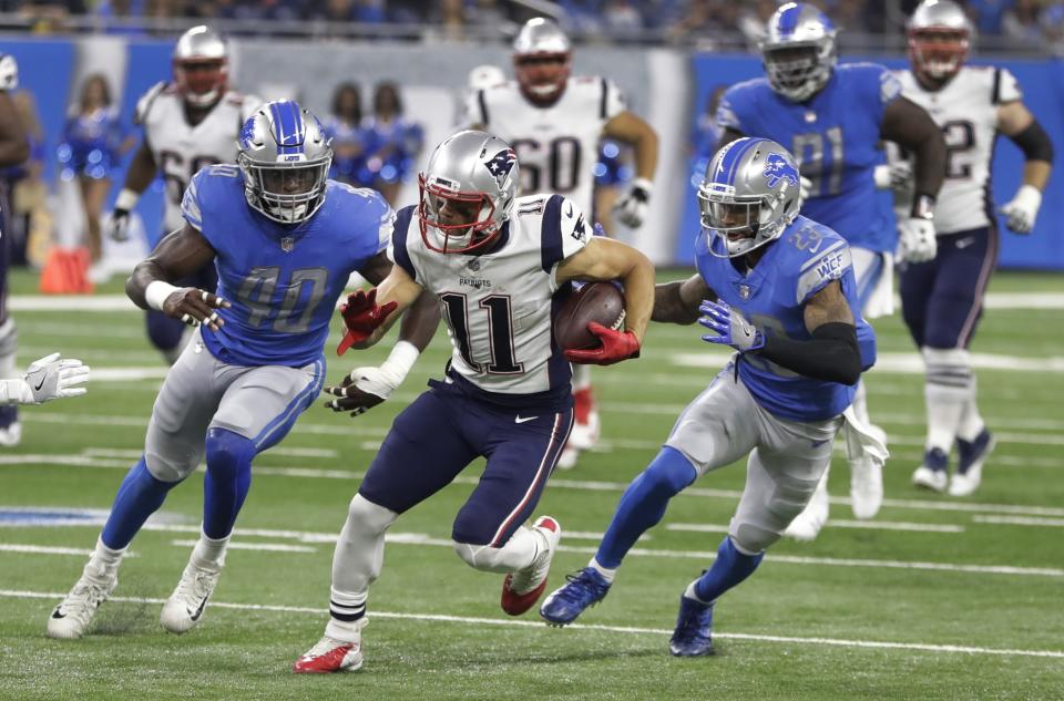 New England WR Julian Edelman, center, left Friday night’s game against the Detroit Lions during the Patriots’ opening possession. (AP)