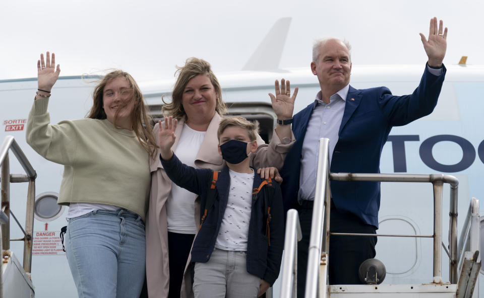 Canada Conservative leader Erin O'Toole right,, Rebecca O'Toole and children Jack and Mollie board the campaign plane Tuesday, Sept. 21, 2021 in Toronto. (Adrian Wyld/The Canadian Press via AP)