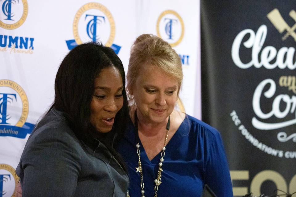 Amazon Regional Policy Leader Cristal Cole (left) hugs Heather Mitchell (right), executive director for the Tallahassee Community College Foundation, during a press conference about the school's partnership with Amazon on Wednesday, Jan. 4, 2022 in Tallahassee, Fla.
