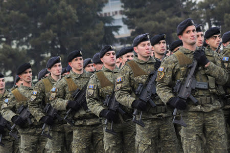 Members of Kosovo's security forces parade a day before parliament's vote on whether to form a national army, in Pristina, Kosovo, December 13, 2018. REUTERS/Laura Hasani