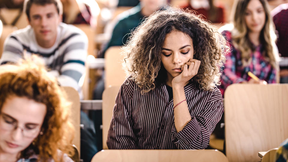 bored college student thinking if college is worth it