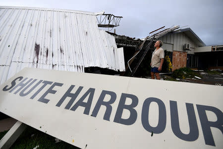 Dave Mcinnerney inspects the damage to his motel after Cyclone Debbie at Shute Harbour in the township of Airlie Beach. AAP/Dan Peled/via REUTERS