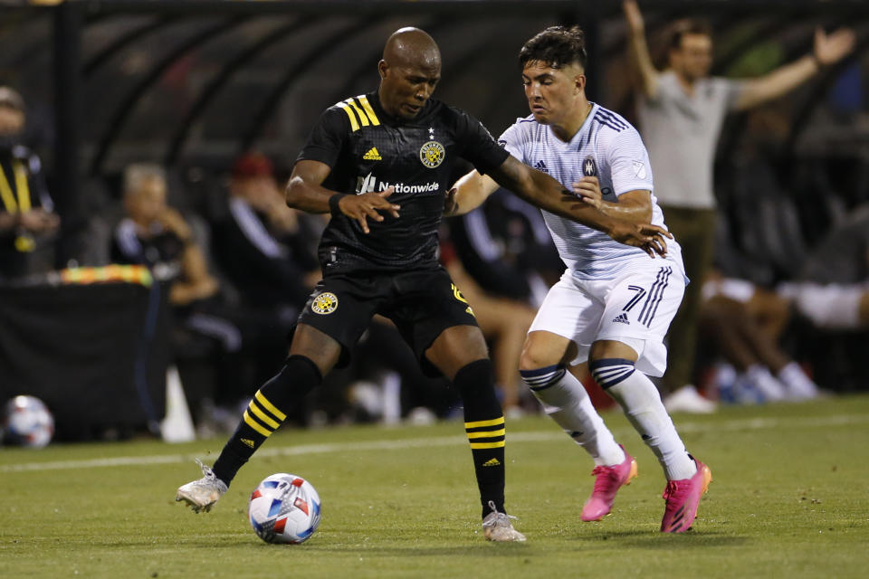 Chicago Fire's Ignacio Aliseda, right, and Columbus Crew's Kevin Molino fight for the ball during the second half of an MLS soccer match Saturday, June 19, 2021, in Columbus, Ohio. (AP Photo/Jay LaPrete)