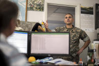 Marine Corps Recruiting Depot Environmental Director, Maj. Marc Blair, right, speak with Natural Resources Manager John Holloway, Jr. in his office, Wednesday, May 11, 2022, in Parris Island, S.C. (AP Photo/Stephen B. Morton)