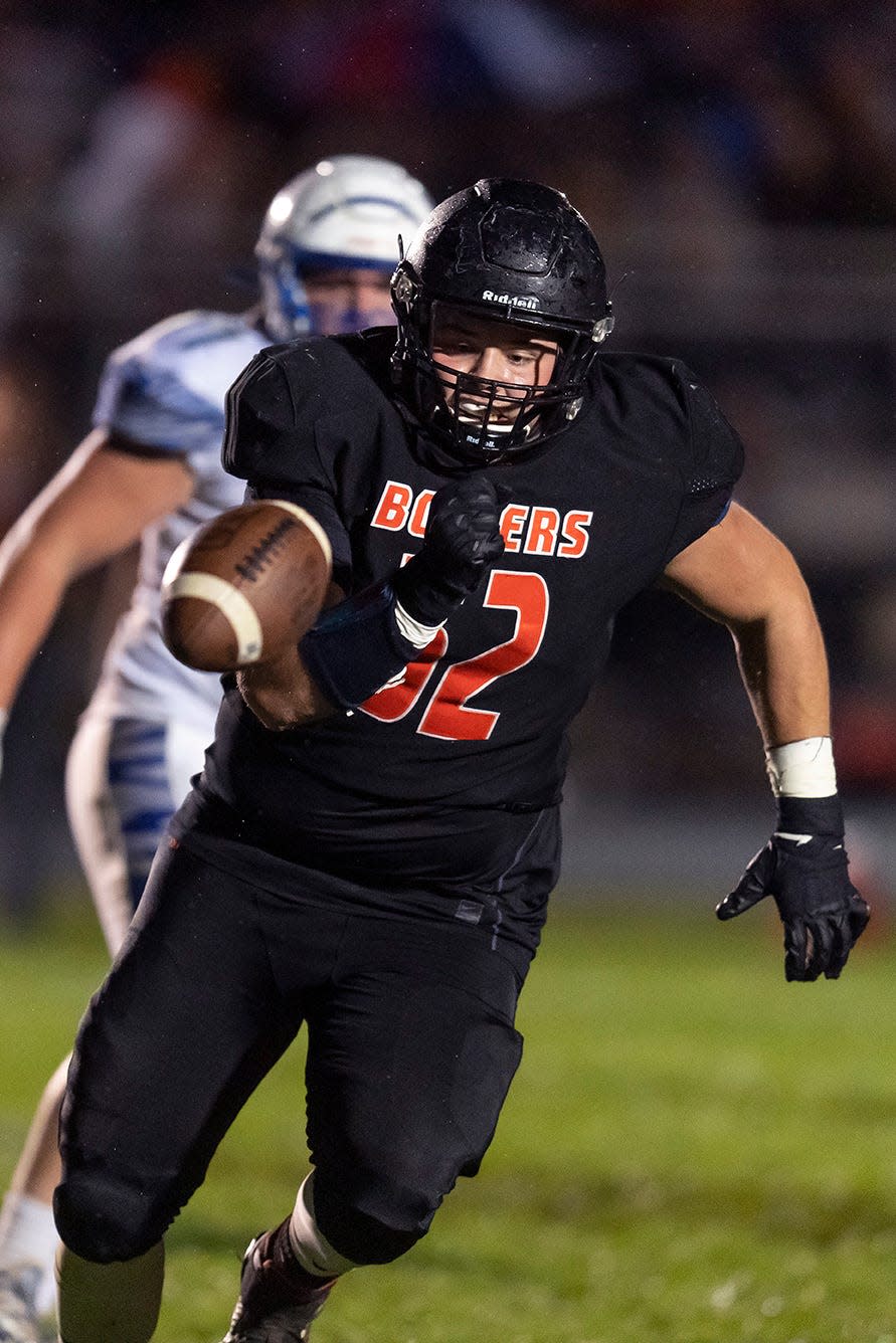 KHS lineman James Conner, shown here chasing down a loose ball, was named to the IHSA's 2021 all-state team following the Boiler's historic football season.