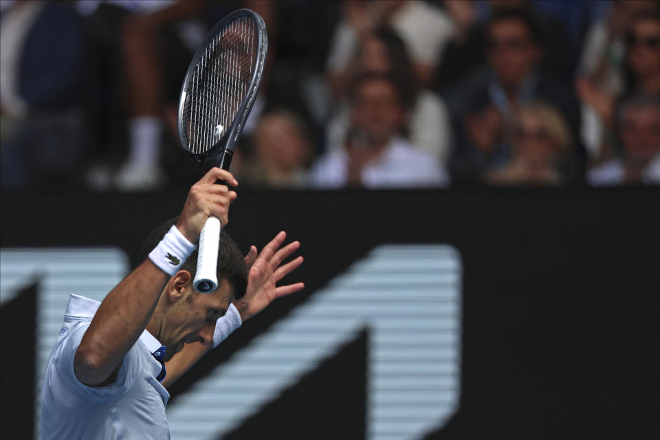 Novak Djokovic of Serbia reacts during his semifinal against Jannik Sinner of Italy at the Australian Open tennis championships at Melbourne Park, Melbourne, Australia, Friday, Jan. 26, 2024. (AP Photo/Asanka Brendon Ratnayake)