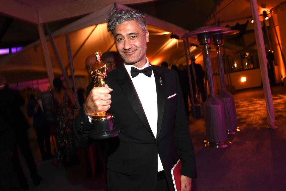 Taika Waititi shows off his Oscar for Best Adapted Screenplay for <em>Jojo Rabbit </em>at the Governor's Ball. 