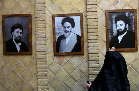 A picture of the late Iranian revolutionary leader Ayatollah Ruhollah Khomeini, (C) is seen at the former home of Khomeini in Najaf, Iraq February 9, 2019. Picture taken February 9, 2019. REUTERS/Alaa al-Marjani