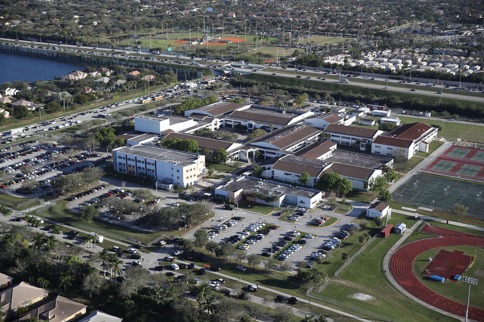 <p>The Marjory Stoneman Douglas High School is seen after a shooting at the school that reportedly killed and injured multiple people on Feb. 14, 2018 in Parkland, Florida. Numerous law enforcement officials continue to investigate the scene. (Photo: Joe Raedle/Getty Images) </p>