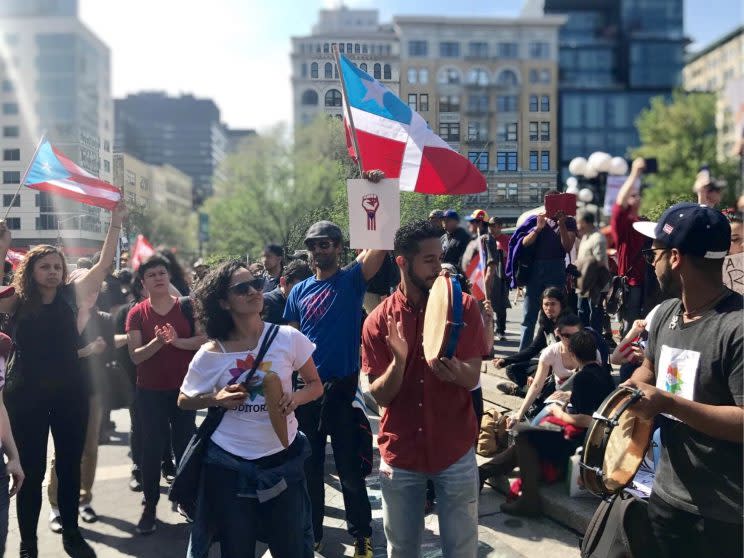 Members of New York's Puerto Rican community play instruments while rallying in solidarity with protesters in Puerto Rico at a May Day event in New York City Monday, May 1, 2017. (Photo: Caitlin Dickson/Yahoo News)